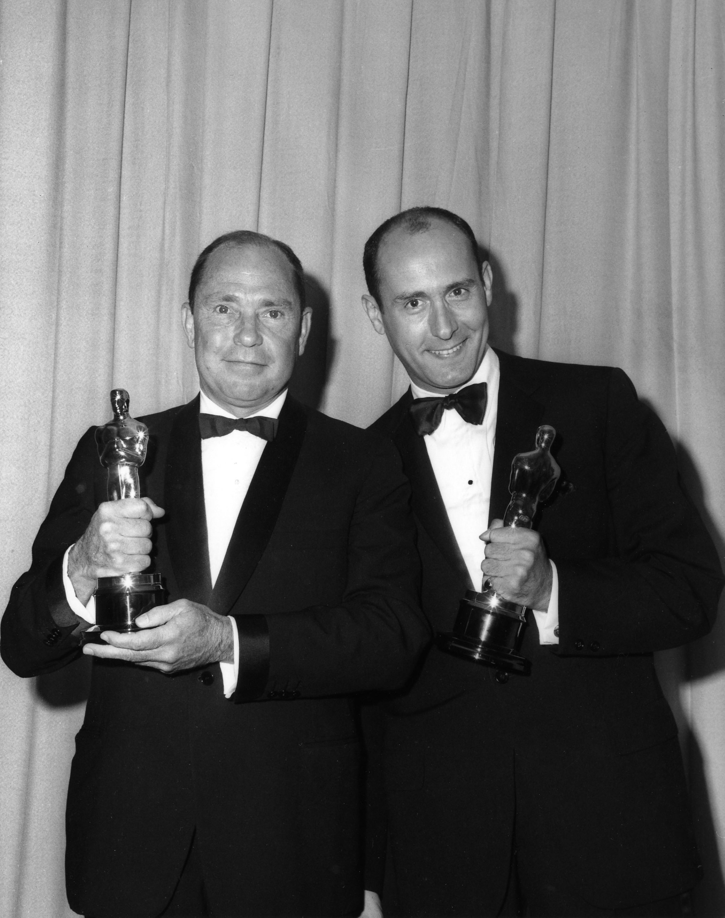 Henry Mancini and Johnny Mercer pose with their Oscars for 