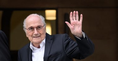 Former FIFA president Sepp Blatter waves to journalists as he leaves Switzerland's Federal Criminal Court, Bellinzona, Switzerland, June 8, 2022. (AFP Photo)