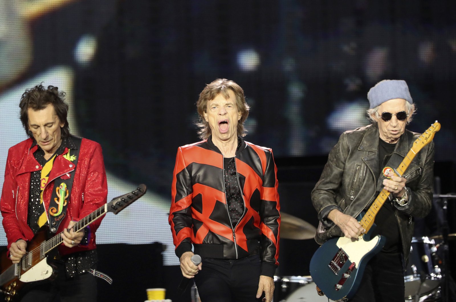 Ronnie Wood (L), Mick Jagger (C) and Keith Richards of The Rolling Stones play on stage at the Anfield Stadium in Liverpool, England, June 9, 2022. (AP)