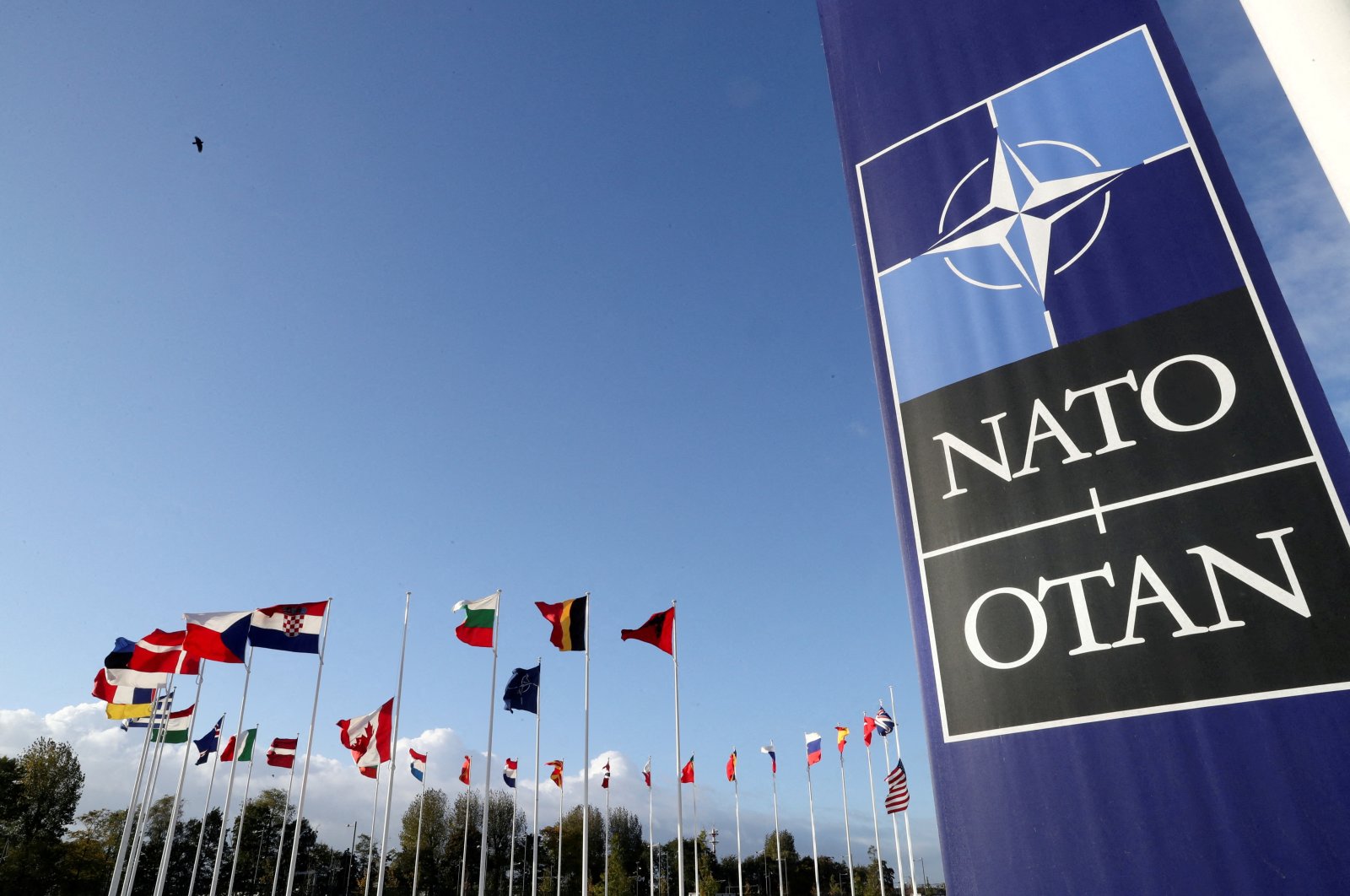 Flags wave outside the headquarters of the NATO alliance in Brussels, Belgium, Oct. 21, 2021. (Reuters Photo)