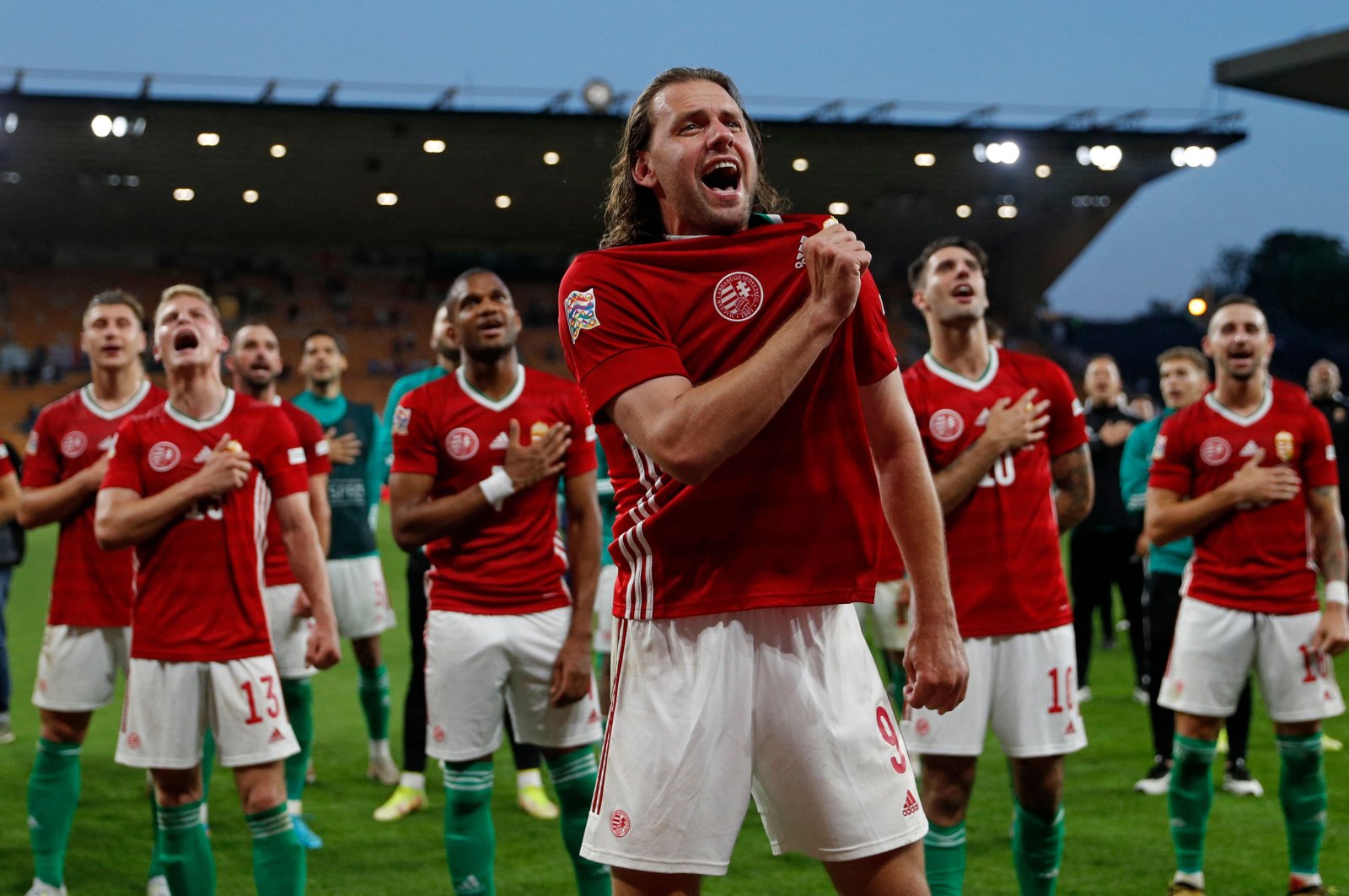 Hungary players celebrate a win over England in the UEFA Nations League, Wolverhampton, England, June 14, 2022. (AFP Photo)