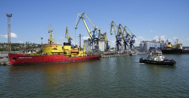 A view of the pier with the grain storage in the background at an area of the Mariupol Sea Port which has recently started its work after a heavy fighting in Mariupol, eastern Ukraine, June 12, 2022. (AP Photo)