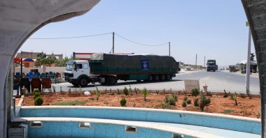 Trucks carrying aid from the World Food Programme (WFP) drive through the town of Saraqib in northwestern Idlib province, Syria, June 12, 2022. (AFP Photo)