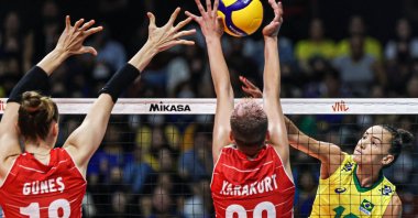 Turkey's Zehra Güneş and Ebrar Karakurt tries to block a shot in a FIVB Nations League tie against Brazil, Brasilia, Brazil, June 16, 2022. (DHA Photo)