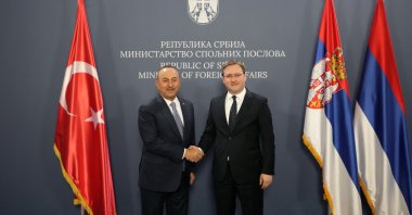 Foreign Minister Mevlüt Çavuşoğlu (L) shakes hands with his Serbian counterpart Nikola Selakovic in Belgrade, Serbia, Thursday, June 16, 2022. (AP Photo)