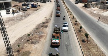 This aerial view shows Turkish-backed Syrian opposition groups in the border town of Azaz as they head toward an area facing the YPG-controlled town of Tal Rifaat, northern Syria, June 9, 2022. (AFP Photo)