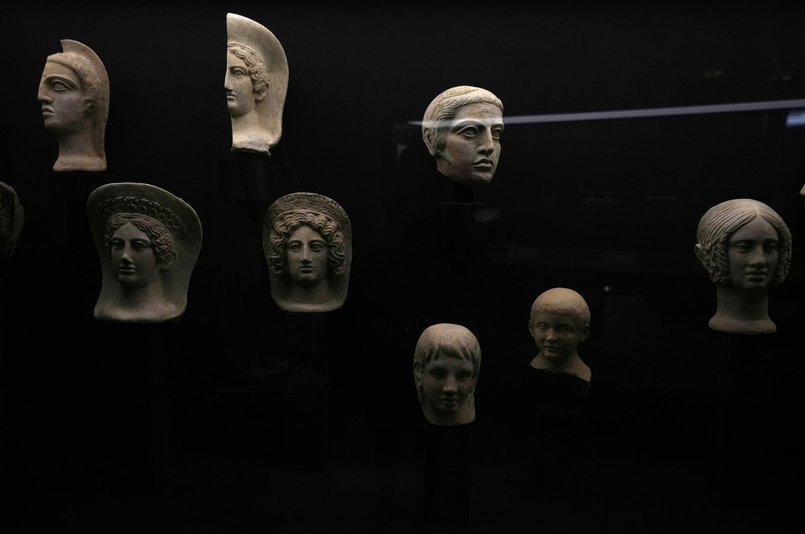 Votive terracotta heads and half-heads from the third and fourth centuries B.C. are displayed in the new &quot;Museum of Rescued Art&quot; in Rome, Italy, Wednesday, June 15, 2022. (AP)