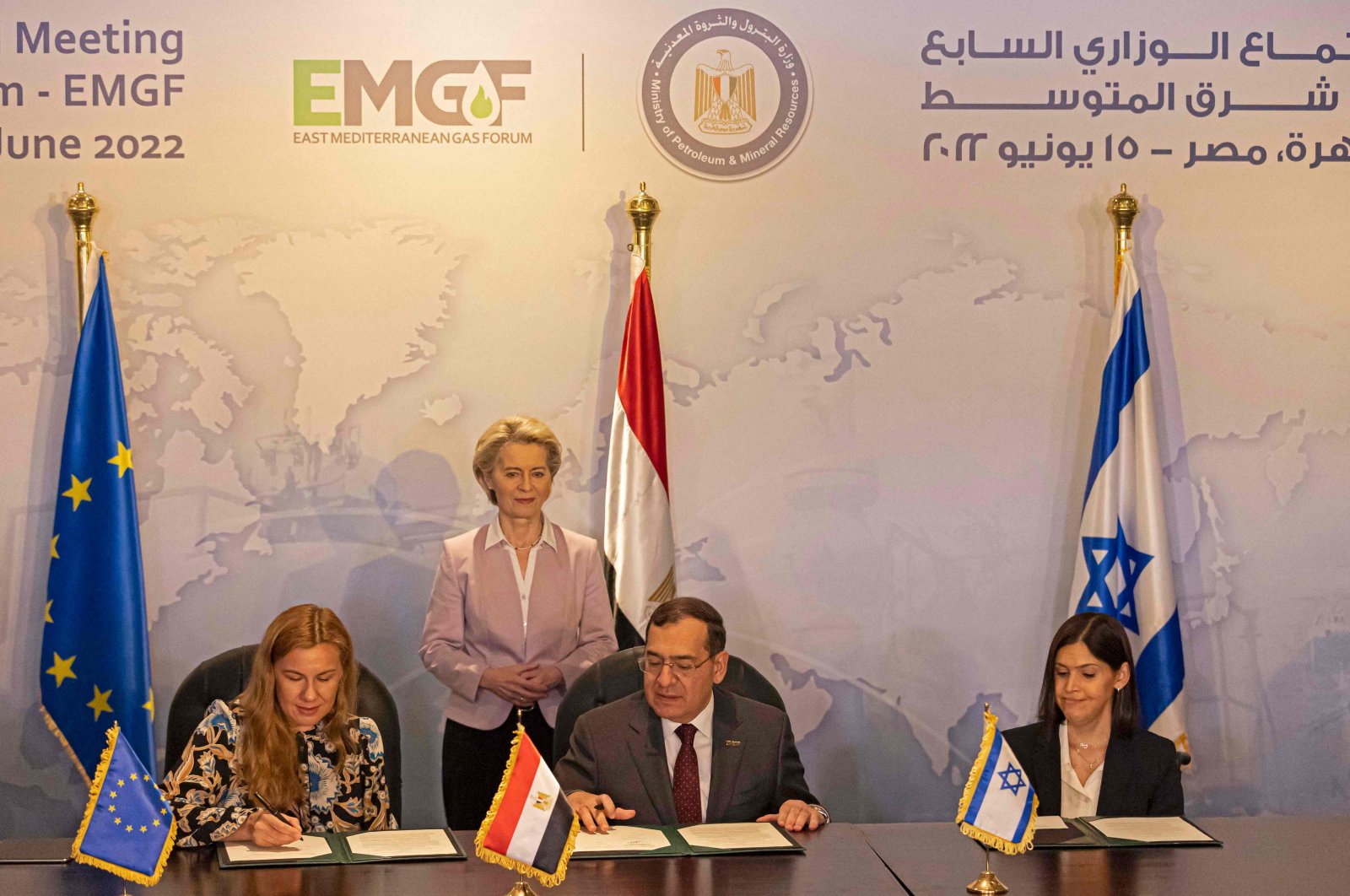 European Commission President Ursula von der Leyen (back) looks on as EU Commissioner for Energy Kadri Simson (L), Egyptian Minister of Petroleum Tarek el-Molla(C), and Israeli Minister of Energy Karine Elharrar (R) sign a trilateral natural gas deal at the ministerial meeting of the East Mediterranean Gas Forum (EMGF) in Cairo, Egypt, June 15, 2022. (AFP Photo)