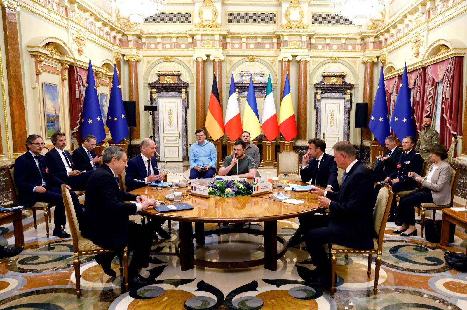 Italian Prime Minister Mario Draghi (L), German Chancellor Olaf Scholz ( 2nd L), Ukrainian President Volodymyr Zelenskyy (C), French President Emmanuel Macron (2nd R), and Romanian President Klaus Iohannis meet for a working session in Mariinsky Palace, Kyiv, Ukraine, June 16, 2022. (AP Photo)
