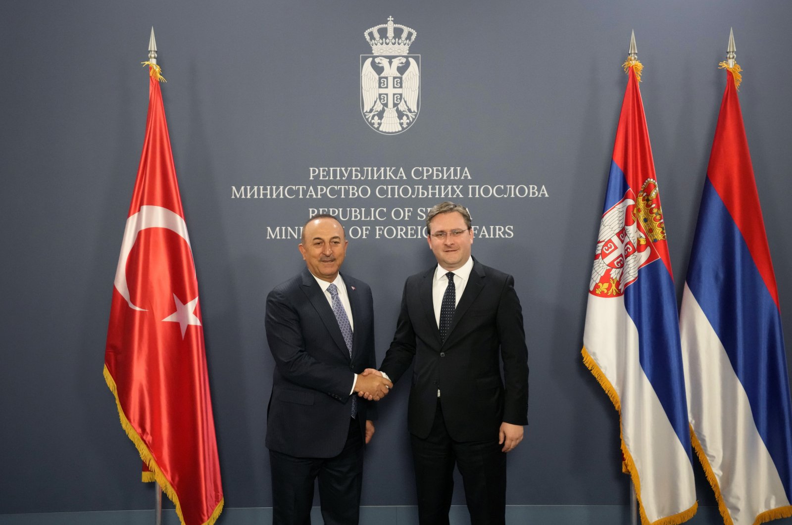 Foreign Minister Mevlüt Çavuşoğlu (L) shakes hands with his Serbian counterpart Nikola Selakovic in Belgrade, Serbia, Thursday, June 16, 2022. (AP Photo)