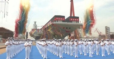 This screen grab made from a video released by Chinese state broadcaster CCTV shows the launch ceremony of the Fujian, a People's Liberation Army (PLA) aircraft carrier, Shanghai, China, June 17, 2022. (AFP photo via CCTV)