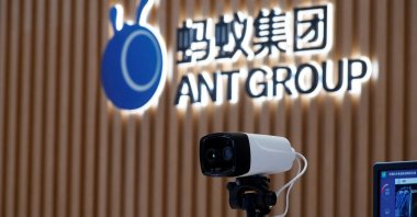 A thermal imaging camera is seen in front of a logo of Ant Group at the headquarters of Ant Group, an affiliate of Alibaba, in Hangzhou, Zhejiang province, China, Oct. 29, 2020.  (Reuters Photo)