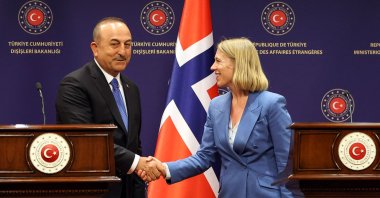 Turkish Foreign Minister Mevlut Cavusoglu (L) and Norwegian Foreign Minister Anniken Huitfeldt (R) shake hands as they hold a joint press conference in Ankara, Turkey, June 15, 2022. (AFP Photo)