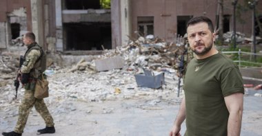 Ukrainian President Volodymyr Zelenskyy inspects damaged buildings as he visits the war-hit Mykolaiv region, Ukraine in this photo provided by the Ukrainian Presidential Press Office on June 18, 2022. (AP Photo)