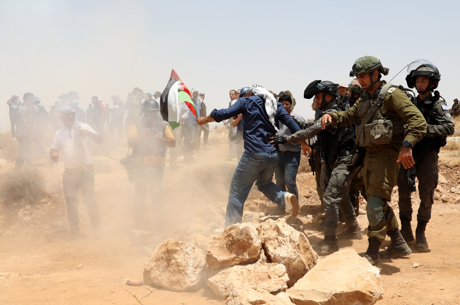 Palestinian protesters confront Israeli security forces during a rally against the eviction of more than 1,000 Palestinians in the West Bank village of Yatta, Palestine, June 17, 2022. (EPA Photo)