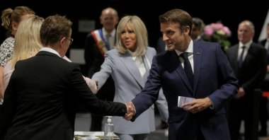 French President Emmanuel Macron and his wife Brigitte Macron arrive to vote during the final round of the country&#039;s parliamentary elections, Le Touquet, France June 19, 2022. (Reuters Photo)