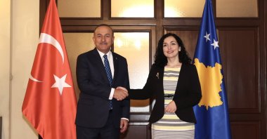 Foreign Minister Mevlüt Çavuşoğlu (L) is received by Kosovo&#039;s President Vjosa Osmani in the capital Pristina, Kosovo, June 20, 2022. (AA)