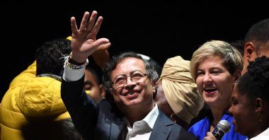 Newly elected Colombian President Gustavo Petro (C) celebrates next to his wife Veronica Alcocer and his running mate Francia Marquez  at the Movistar Arena in  Bogota, Colombia, June 19, 2022. (AFP Photo)