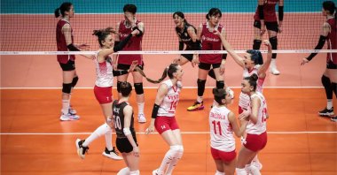 Turkish players celebrate beating South Korea 3-1 in the 2022 FIVB Volleyball Women's Nations League, Brasilia, Brazil, June 19, 2022. (AA Photo)