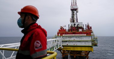An employee is seen at an oil platform operated by Lukoil company at the Kravtsovskoye oilfield in the Baltic Sea, Russia, Sept. 16, 2021. (Reuters Photo)
