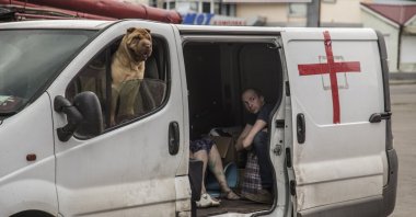 Locals about to be evacuated sit in a vehicle in Lysychansk, Luhansk, Ukraine, June 18, 2022. (EPA Photo)