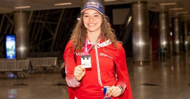 Aerobic gymnast Ayşe Begüm Onbaşı poses for a photo at the airport in Izmir, Turkey, June 20, 2022. (AA Photo)