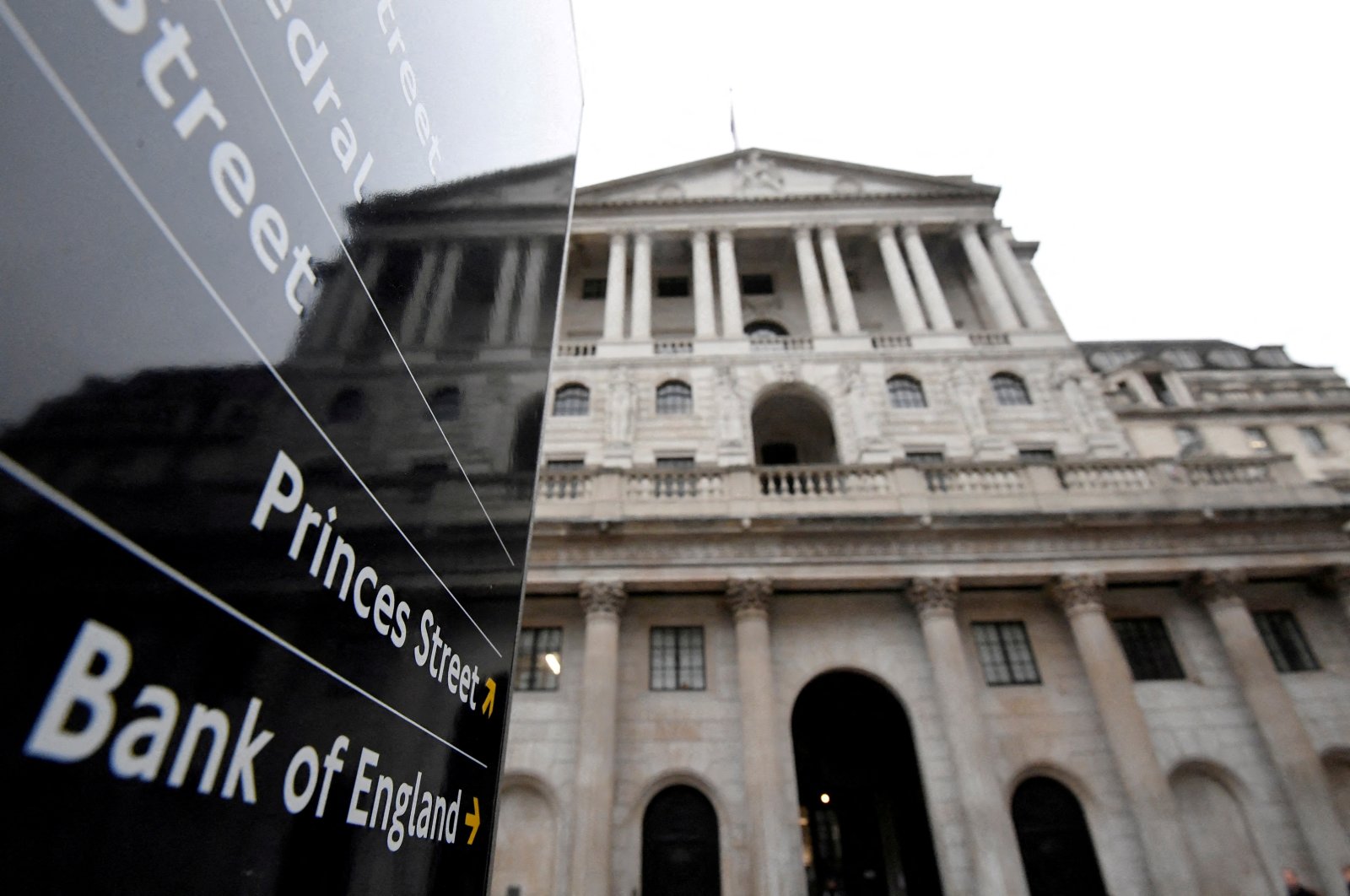 The Bank of England (BoE) building is reflected in a sign, London, Britain, Dec. 16, 2021. (Reuters Photo)