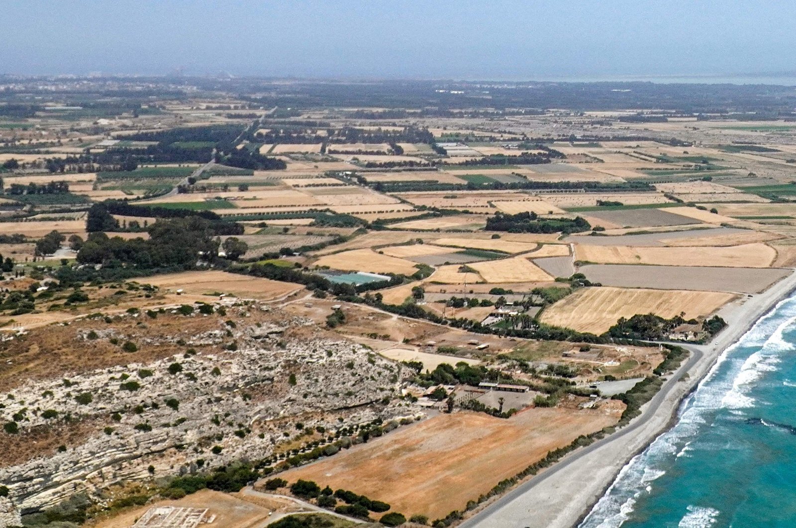 An aerial view of the ancient site of Kourion along Episkopi bay at the Akrotiri British military sovereign base area (SBA) west of Limassol, Greek Cyprus administration, May 24, 2022. (AFP Photo)