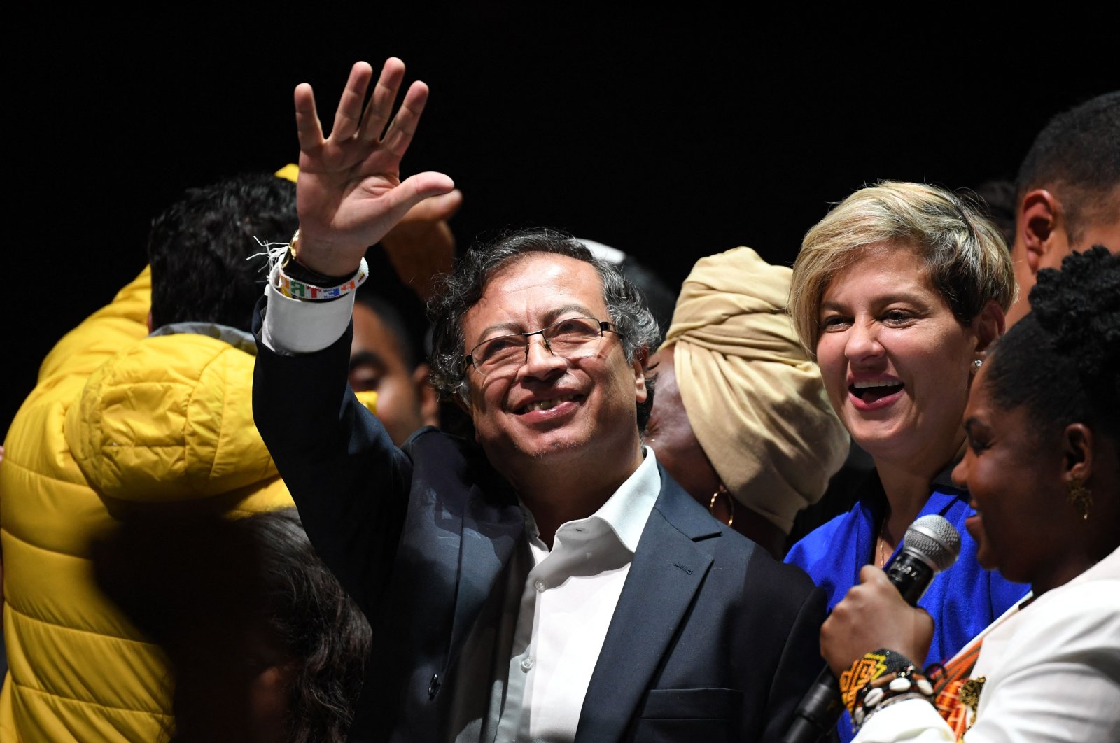 Newly elected Colombian President Gustavo Petro (C) celebrates next to his wife Veronica Alcocer and his running mate Francia Marquez  at the Movistar Arena in  Bogota, Colombia, June 19, 2022. (AFP Photo)