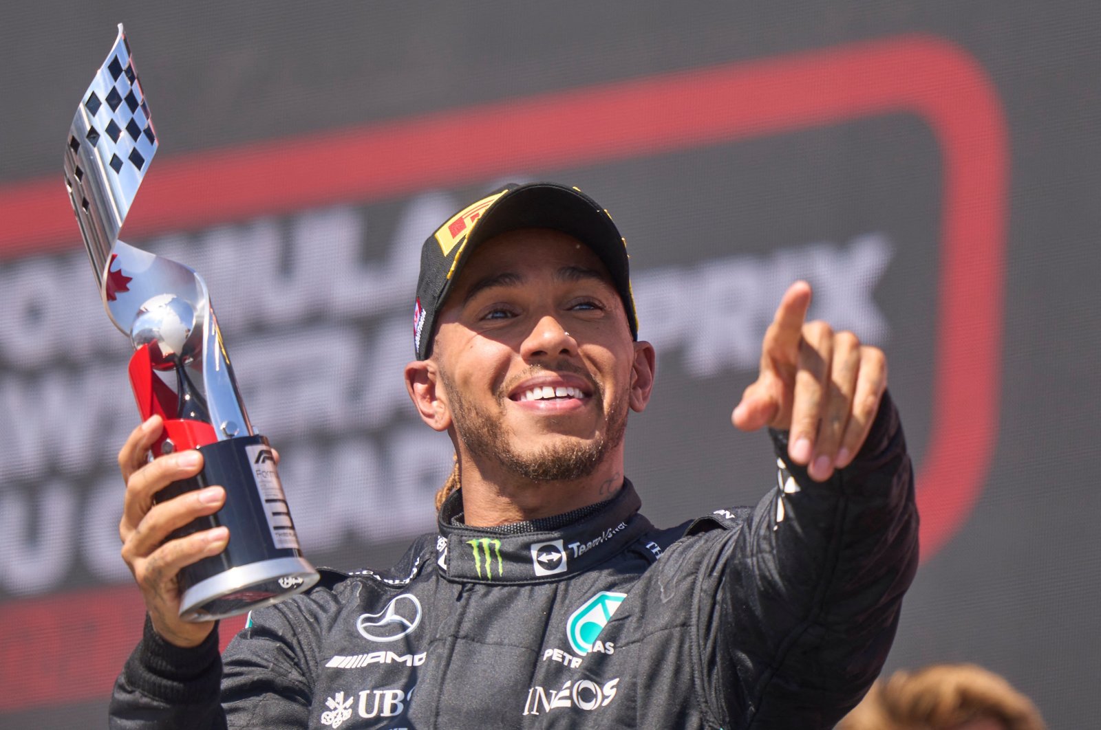 Mercedes&#039; British driver Lewis Hamilton celebrates on the podium after placing third at the Canada Formula 1 Grand Prix, Montreal, Canada, June 19, 2022. (AFP Photo)