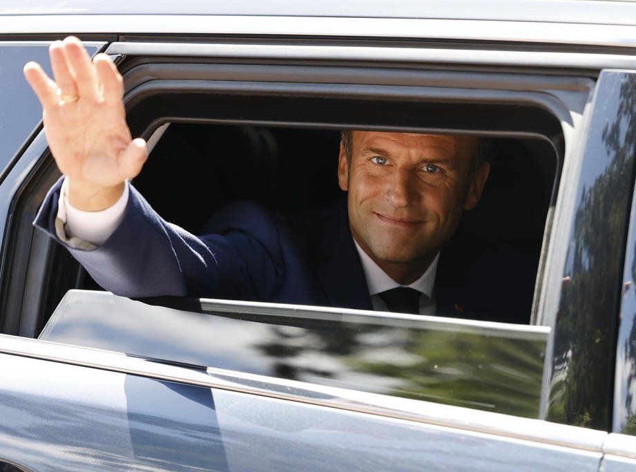 France&#039;s President Emmanuel Macron waves as he leaves after voting in the French parliamentary elections at a polling station in Le Touquet, northern France, June 12, 2022. (EPA Photo)