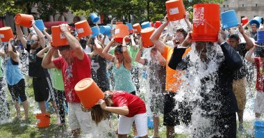 People participate in the Ice Bucket Challenge, in Boston, U.S., Aug. 7, 2014. (AP Photo)