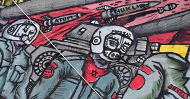 A detail of the controversial large-scale figurative representation "People's Justice" (2002) by Taring Padi, a collective of underground artists from Indonesia, depicting a soldier with a pig's face wearing a scarf with a Star of David and a helmet with the inscription "Mossad" is pictured during the documenta fifteen contemporary art exhibition in Kassel, Germany, June 20, 2022. (AFP)