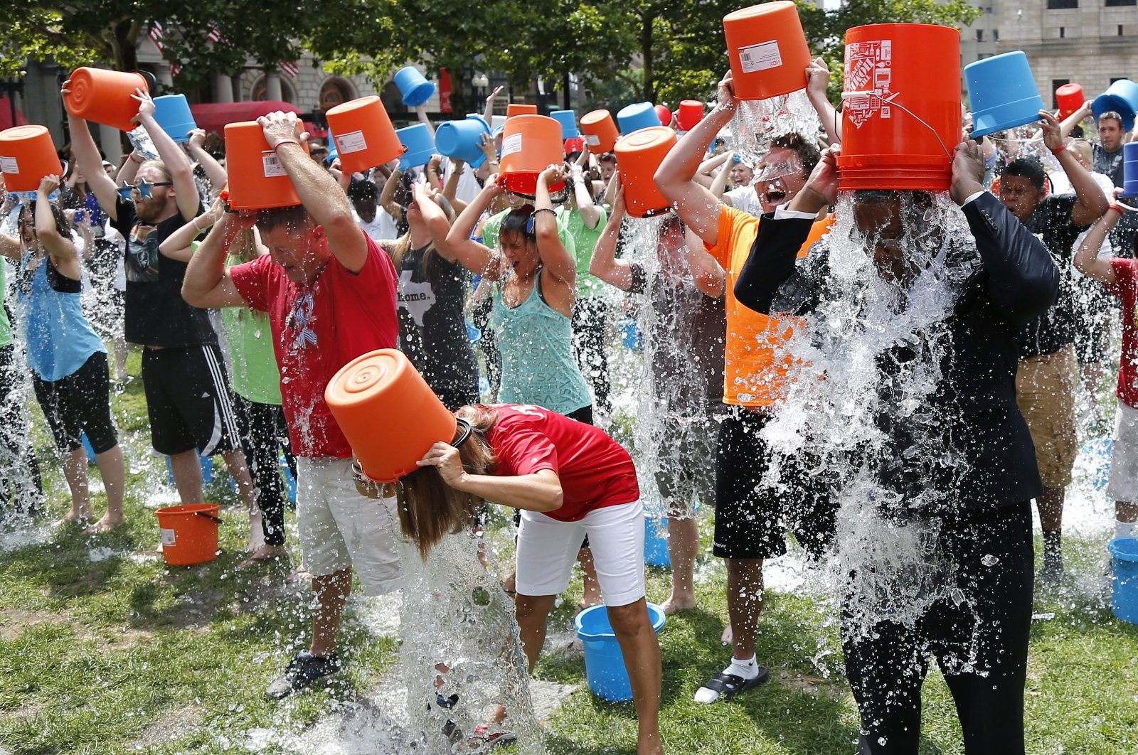 People participate in the Ice Bucket Challenge, in Boston, U.S., Aug. 7, 2014. (AP Photo)