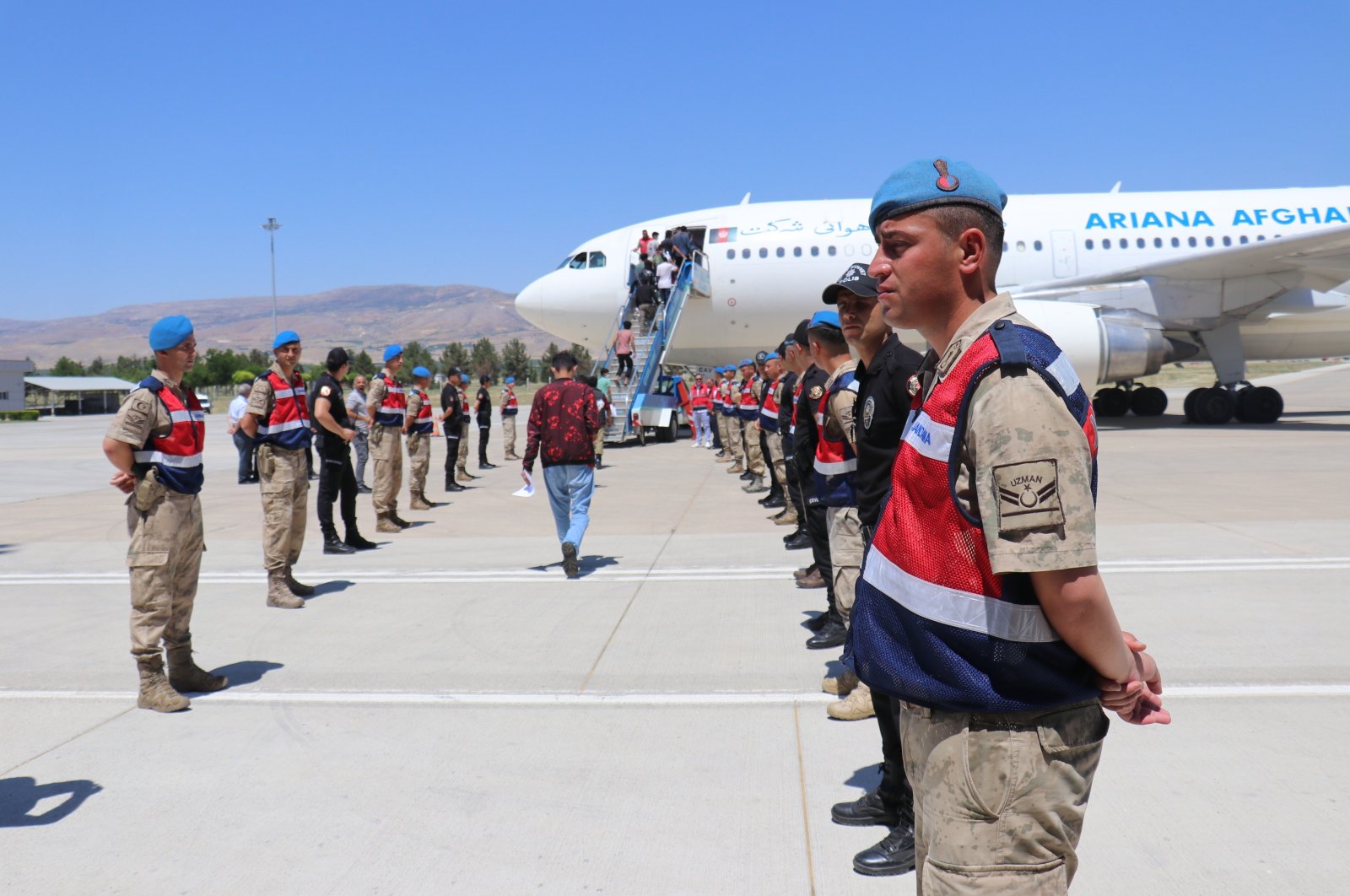 Some 135 Afghan migrants that entered the country illegally were repatriated from Malatya, Turkey, June 21, 2022 (IHA Photo)