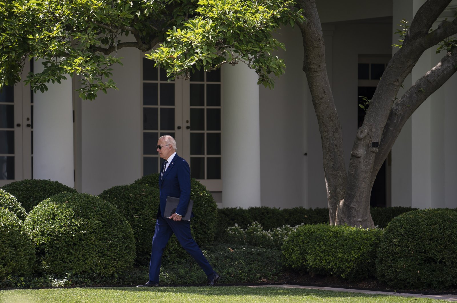 U.S. President Joe Biden walks through the Rose Garden to the Oval Office, after visiting a COVID-19 vaccination clinic in Washington, D.C., U.S., June 21, 2022. (EPA Photo)