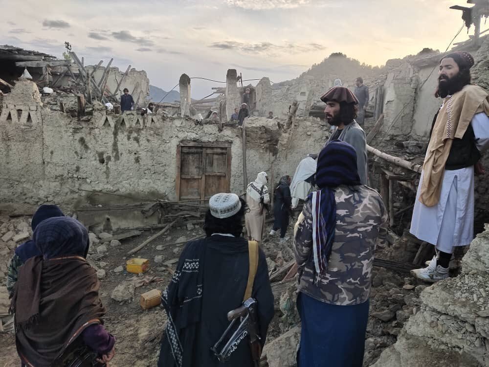 In this photo released by the state-run Bakhtar News Agency, Afghans look at the destruction caused by an earthquake in the province of Paktika, eastern Afghanistan, June 22, 2022. (AP Photo)