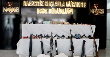 A police display of guns and drugs seized in operations, in Diyarbakır, southeastern Turkey, June 22, 2022. (AA PHOTO)