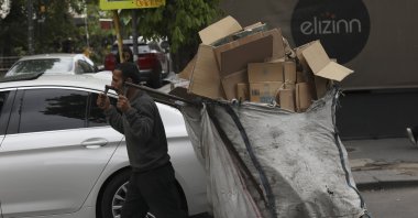 A trash collector pulls a cart in the capital Ankara, Turkey, May 5, 2022. (AP PHOTO) 