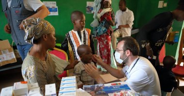 A Turkish doctor conducts a check-up on a local boy, in Sikasso, Mali, June 22, 2022. (AA PHOTO)