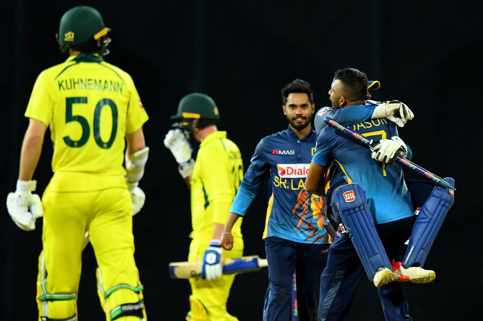 Sri Lanka&#039;s skipper Dasun Shanaka (R) and wicketkeeper Niroshan Dickwella celebrate after winning by 4 runs against Australia, Colombo, Sri Lanka, June 21, 2022. (AFP Photo)