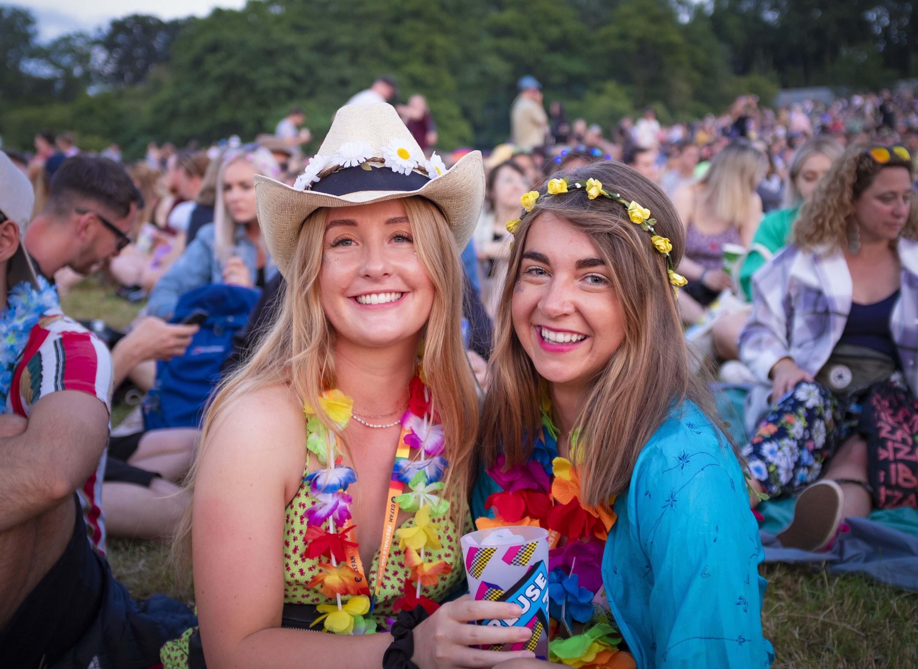 Eden Beirne, 26, and Izzi Gale, 25, pose for a photo on the first day of the Glastonbury Festival, Pilton, Britain, June 22, 2022. (EPA)