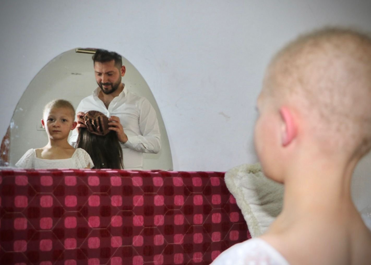 Yasin Kirazlı, 28, a hairdresser living in Turkey&#039;s capital Ankara helps in making an 8-year-old Syrian girl, Hale Bereket&#039;s dream come true with the wig he made, Ankara, Turkey, June 22, 2022. (DHA Photo)