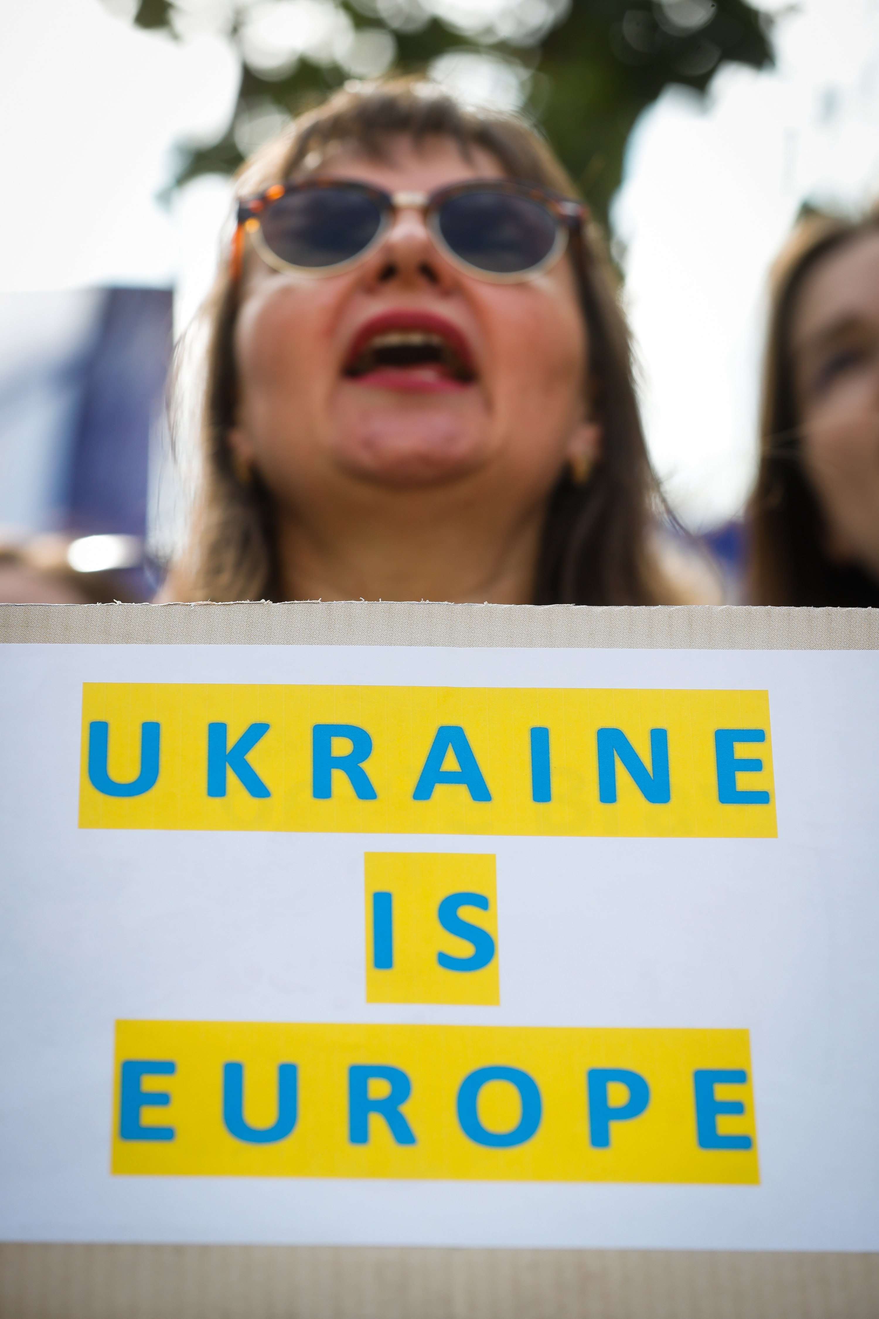 A protester demonstrates in front of the European Council to demand EU accession for Ukraine, Brussels, Belgium, June 23, 2022. (EPA Photo)
