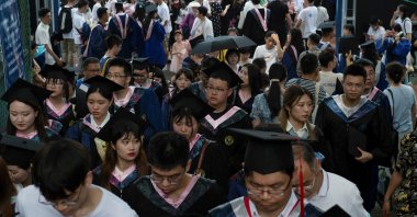 Graduates, including students who could not attend last year due to the coronavirus pandemic, attend a graduation ceremony at Central China Normal University in Wuhan, Hubei province, China, June 13, 2021. (Reuters Photo)