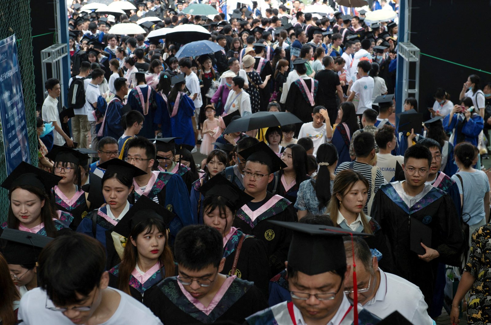 Graduates, including students who could not attend last year due to the coronavirus pandemic, attend a graduation ceremony at Central China Normal University in Wuhan, Hubei province, China, June 13, 2021. (Reuters Photo)