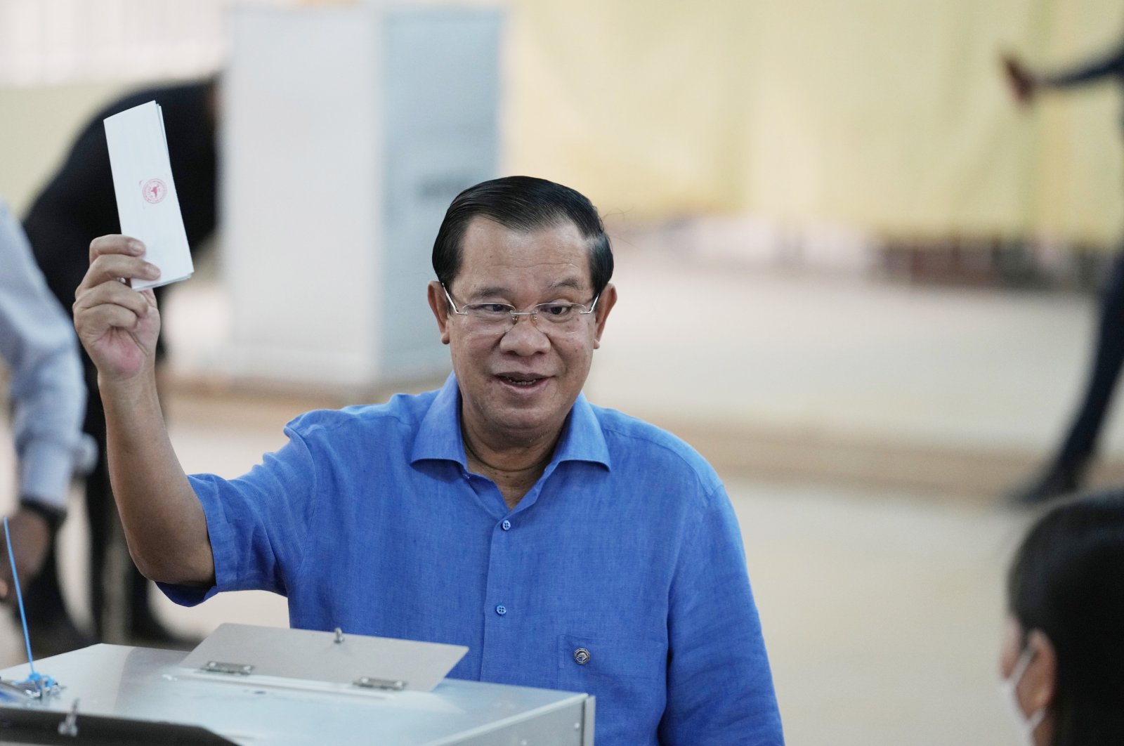 Cambodian Prime Minister Hun Sen, of the Cambodian People&#039;s Party (CPP), holds his ballot before dropping it into a ballot box at a polling station in Takhmua in Kandal province, southeast of Phnom Penh, Cambodia, June 5, 2022. (AP Photo)
