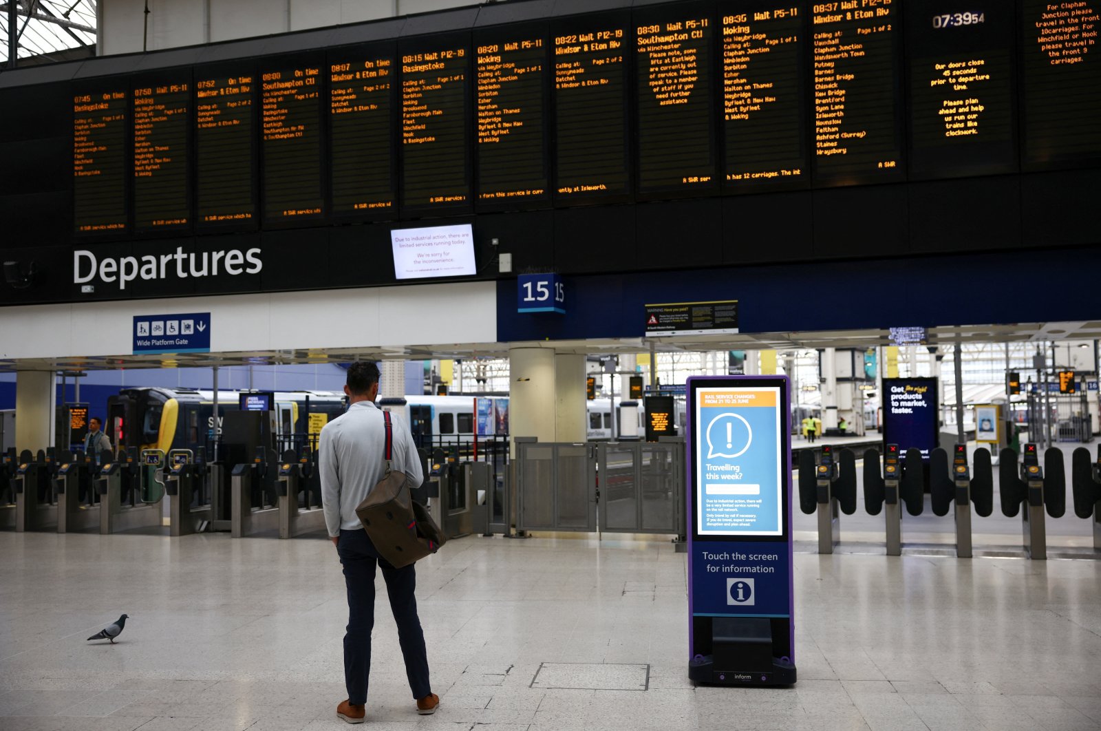 A commuter stands at Waterloo station, in London, Britain, June 23, 2022. (Reuters Photo)