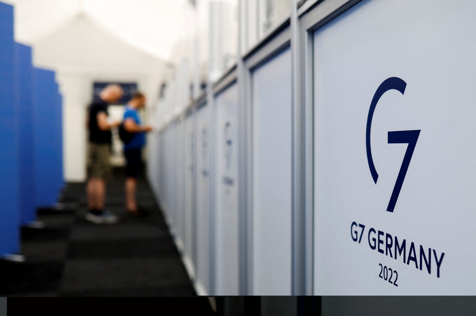 People pick up their accreditation for the G7 Summit, Garmisch-Partenkirchen, Germany, June 23, 2022. (Reuters Photo)