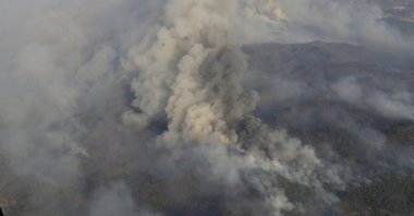 A view of smoke billowing from the burning forest, from a helicopter responding to the fire, in Marmaris, Muğla, southwestern Turkey, June 24, 2022. (AA PHOTO)